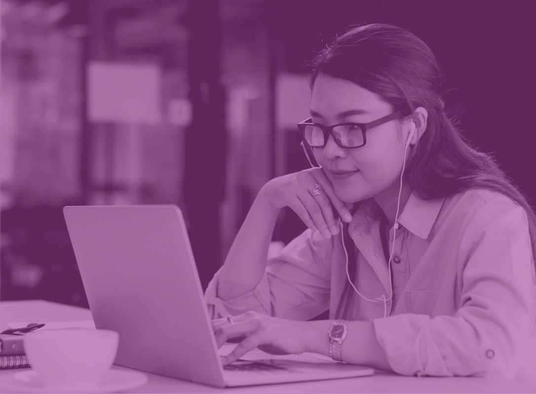 Outsourced IT support helping employees in office