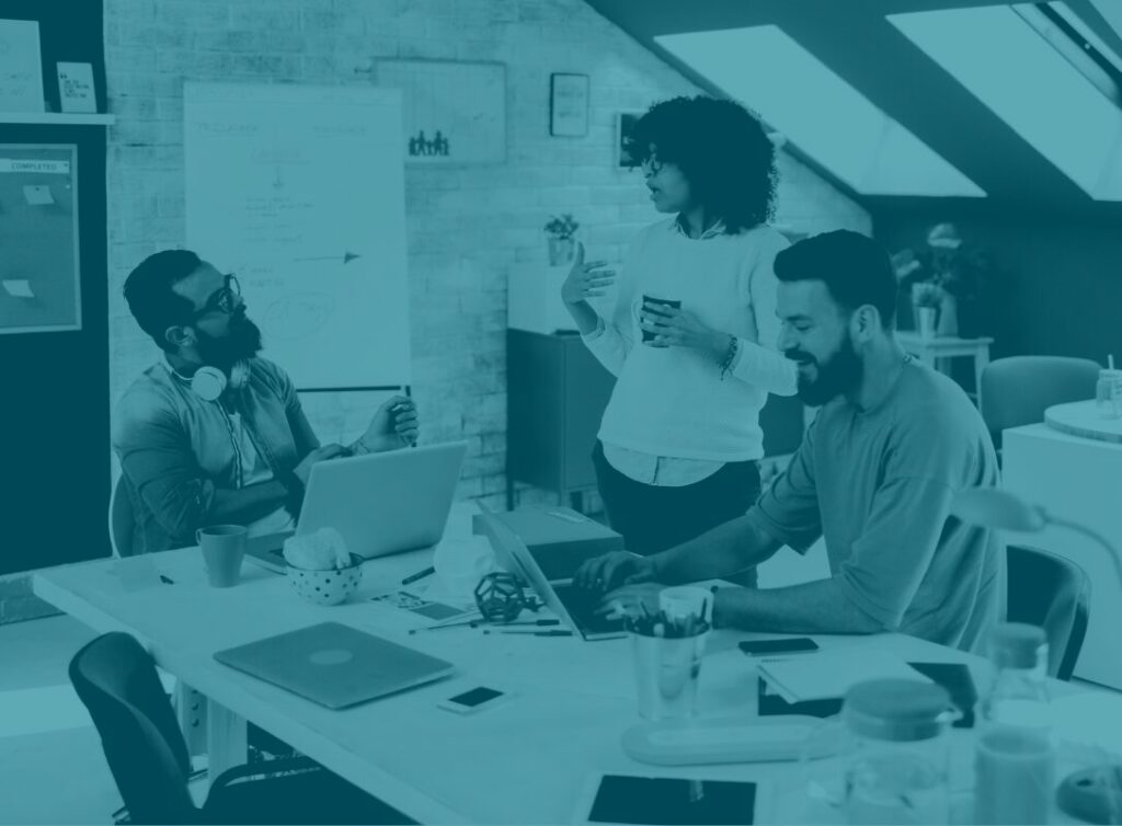 Office workers discussing Microsoft 365 for business