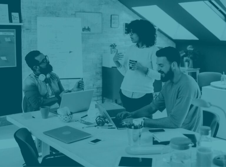 Office workers discussing Microsoft 365 for business