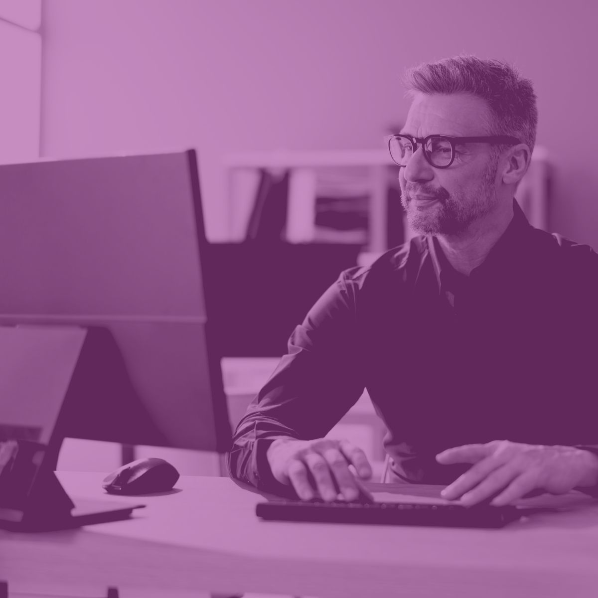 Outsourced IT support helping employees in office